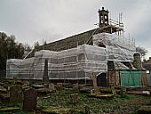 south wall of East Church covered in scaffold